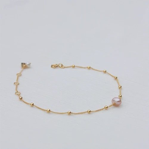 Bracelet doré avec pierre en nacre rose poudrée - La rosée