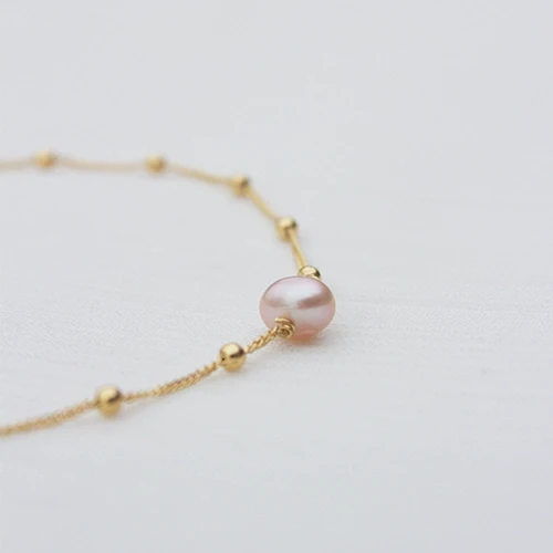 Bracelet doré avec pierre en nacre rose poudrée - La rosée
